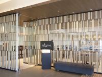 a store front with a sign on the glass wall at Nihon Seinenkan Hotel in Tokyo
