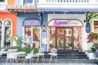 a group of tables and chairs outside of a store at Riverside Mini Hotel Grand World Phu Quoc in Phu Quoc