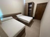 A bed or beds in a room at MARINA SKY