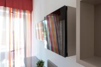 A television and/or entertainment centre at Zenit Hotel