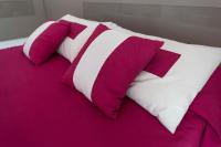 A bed or beds in a room at Zenit Hotel
