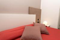 A bed or beds in a room at Zenit Hotel