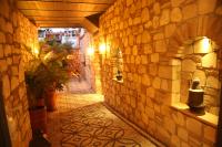 an alley way with a stone wall and a plant at Exceptional Studio Flat near Hadrian&#39;s Gate in Antalya