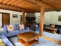 a living room with blue couches and a fireplace at Ancienne Auberge des Brizards - Morvan (14 personnes) in Quarré-les-Tombes