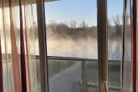 a view of a window with smoke coming out at Appartement T3 bord de la Vienne in Chinon
