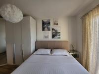 Postel nebo postele na pokoji v ubytování Apartman Rosa