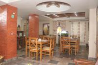 a dining room with wooden tables and chairs at Hotel Vacation Home Kathmandu - Thamel in Kathmandu