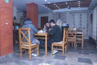 a group of people sitting at a table at Hotel Vacation Home Kathmandu - Thamel in Kathmandu