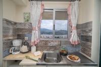 A kitchen or kitchenette at Aphrodite Superb Sea View Apartment