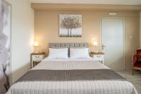 A bed or beds in a room at Aphrodite Superb Sea View Apartment