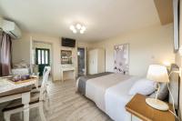 A bed or beds in a room at Aphrodite Superb Sea View Apartment