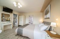 A bed or beds in a room at Aphrodite Superb Sea View Apartment