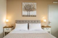 A bed or beds in a room at Aphrodite Superb Sea View Apartment