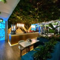 a restaurant with a table and chairs and a bar at Private Apartment Grand Resort 11 in Sunny Beach