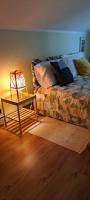 A bed or beds in a room at La Mia Mansardina