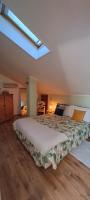 A bed or beds in a room at La Mia Mansardina