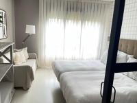 Postel nebo postele na pokoji v ubytování Apartamentos Las Vegas