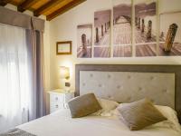 Posteľ alebo postele v izbe v ubytovaní Hotel Villa Cariola