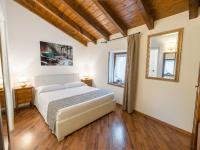 Posteľ alebo postele v izbe v ubytovaní Hotel Villa Cariola
