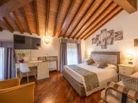Posteľ alebo postele v izbe v ubytovaní Hotel Villa Cariola