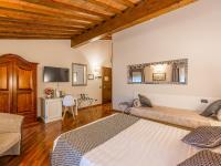 Posteľ alebo postele v izbe v ubytovaní Hotel Villa Cariola