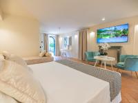 Posteľ alebo postele v izbe v ubytovaní Hotel Villa Cariola