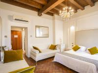 Posteľ alebo postele v izbe v ubytovaní Hotel Villa Cariola