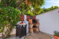 A garden outside Villa Anais - PlusHolidays