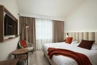 Postel nebo postele na pokoji v ubytování Hotel Klaustur