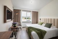 Postel nebo postele na pokoji v ubytování Hotel Klaustur