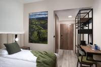 Postel nebo postele na pokoji v ubytování Hotel Klaustur