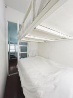 Postel nebo postele na pokoji v ubytování Rotinis Hostel