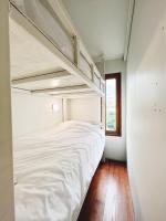 Postel nebo postele na pokoji v ubytování Rotinis Hostel