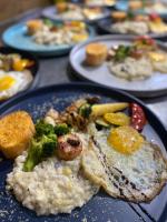 a blue plate of food with rice and broccoli at Mini Summer in Nanwan