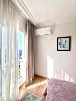 Łóżko lub łóżka w pokoju w obiekcie Ocean Pearl Apartment