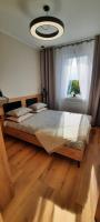 Posteľ alebo postele v izbe v ubytovaní Asti Apartamenty Centrum Stargard