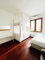 Postel nebo postele na pokoji v ubytování Rotinis Hostel