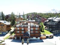 an aerial view of a resort building at Résidence Les Sapins - Courchevel 1850 in Courchevel