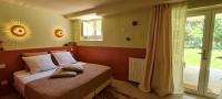 Ein Bett oder Betten in einem Zimmer der Unterkunft Villa Aigarden maison d&#39;hôtes