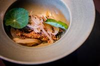 a bowl of soup with a plant in it at Hotel Akureyri in Akureyri
