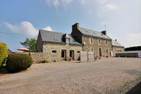 a large brick building with a driveway in front of it at Le four a pain in Pleubian