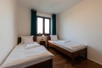 Postel nebo postele na pokoji v ubytování PALAVIA Apartments