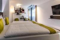 Tempat tidur dalam kamar di ARCOTEL Donauzentrum Wien