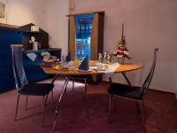 a dining room table and chairs with a christmas tree on it at Hotel Bavaria Brehna in Brehna