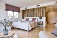Postel nebo postele na pokoji v ubytování Villa Luna Suites