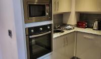 Kuchyň nebo kuchyňský kout v ubytování Harrogate Lifestyle Luxury Serviced ApartHotel