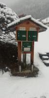a sign with snow on top of it at Le Lièvre Blanc, appartement N°2 in Les Contamines-Montjoie