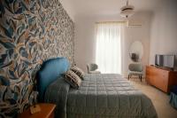 A bed or beds in a room at GARRUBA house 1