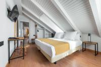 Postel nebo postele na pokoji v ubytování Hotel Viella