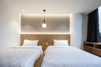 Changsha Desti Youth Park Hostel Wuyi Squareにあるベッド